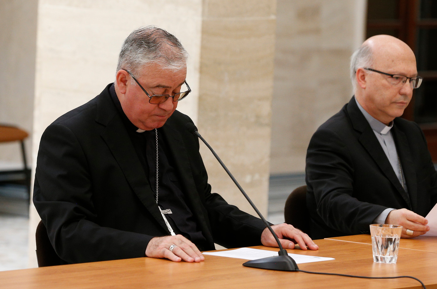 Bishop Juan Ignacio Gonzalez Errazuriz of San Bernardo, Chile, and Auxiliary Bishop Fernando Ramos Perez of Santiago, Chile, attend a press conference in Rome May 18. Bishop Gonzalez said every bishop in Chile offered his resignation to Pope Francis after a three-day meeting with him at the Vatican.
